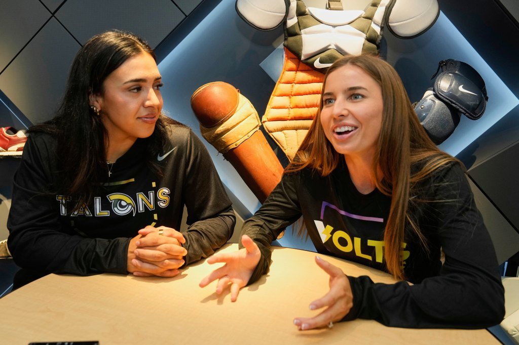 Athletes Unlimited Softball League players Sharlize Palacios (left) of the Talons, and Sis Bates of the Bolts, are interviewed at Major League Baseball's headquarters on May 29, 2025.